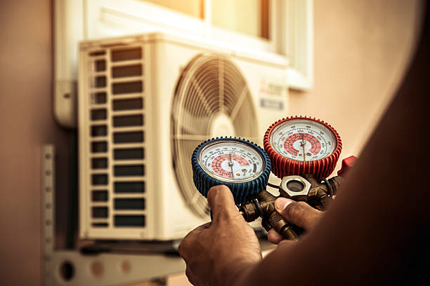 Professional Air Conditioning Service technician working in Riverview, MI